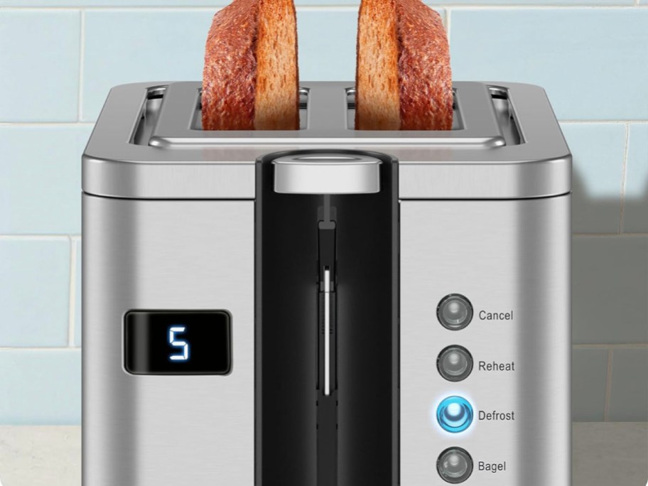 stainless steel toaster with bagel popped out