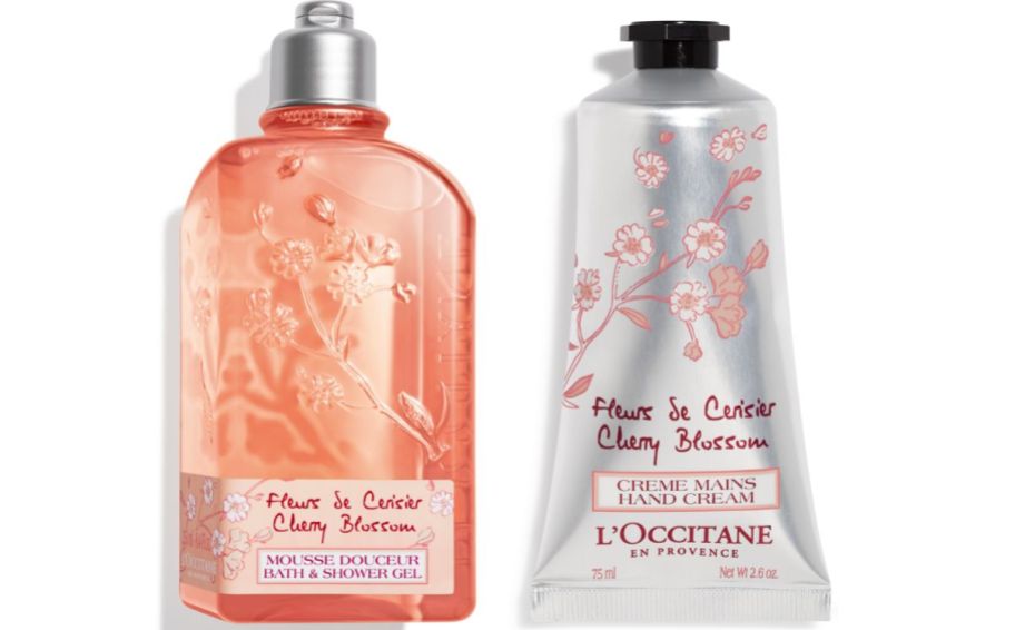 a bottle of cherry blossom shower gel with a tube of cherry blossom hand cream