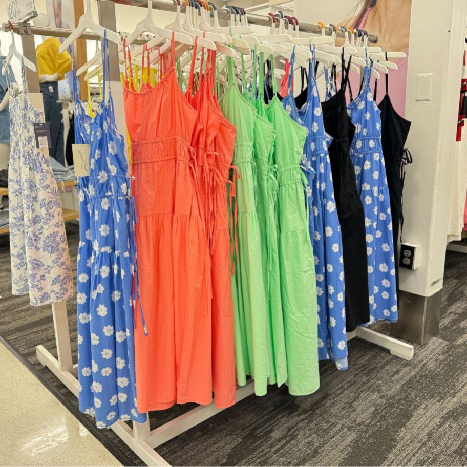 a rack of colorful sundresses in a target store