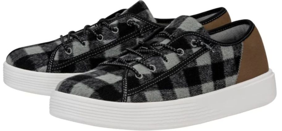 a piar of black and gray buffalo plaid sneakers