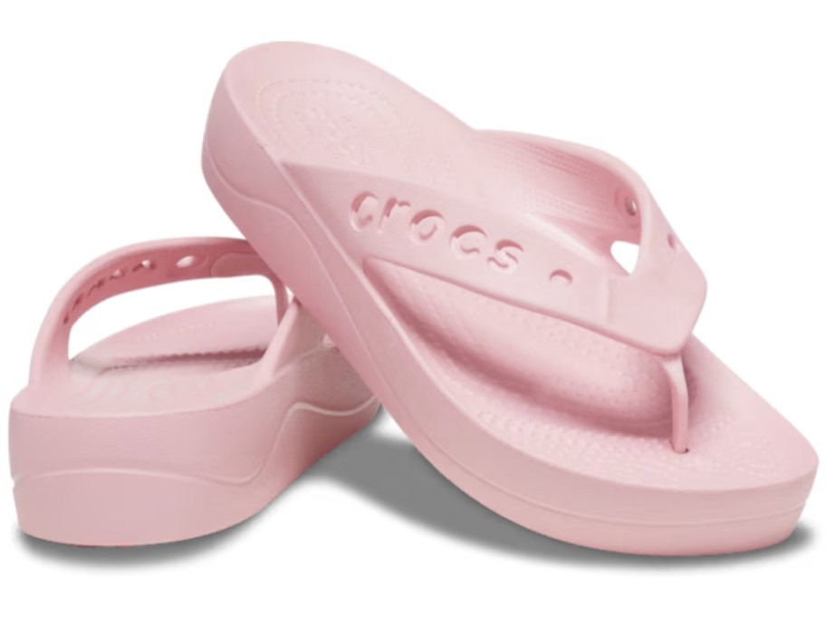 pair of pink women's Crocs platform flip flops