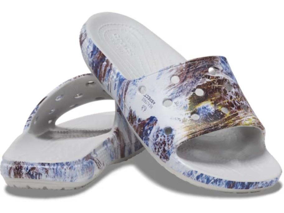 pair of men's Crocs Real Tree slides with blue and brown faded camo
