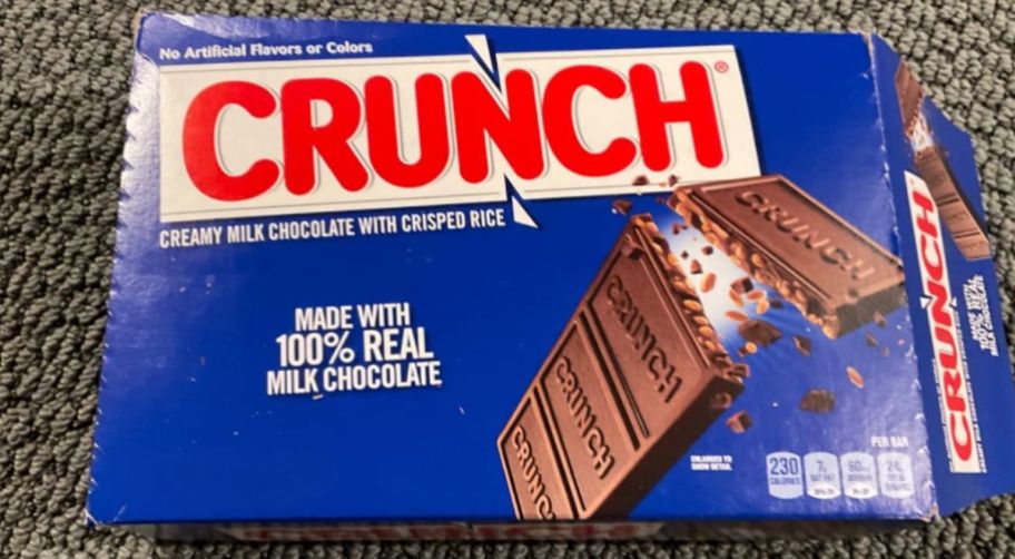 an 18 count box of full six crunch bars sitting on a rug