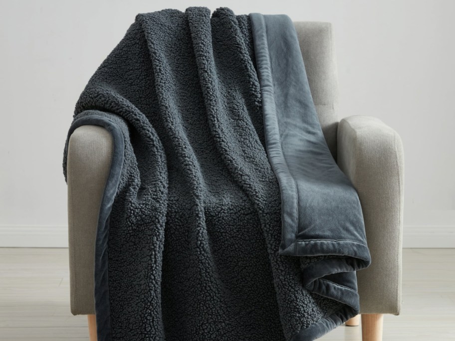 dark gray throw blanket faux teddy displayed on a chair