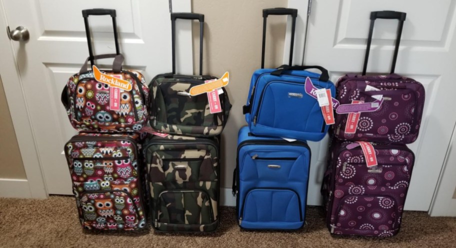 display of four luggage sets in different patterns