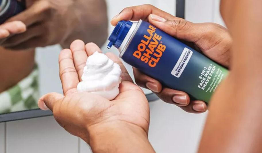 a man dispensing shaving foam from a can into his hand
