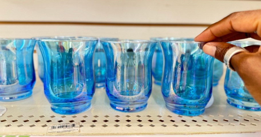 blue Hurricane Glass Candle Holders on a shelf