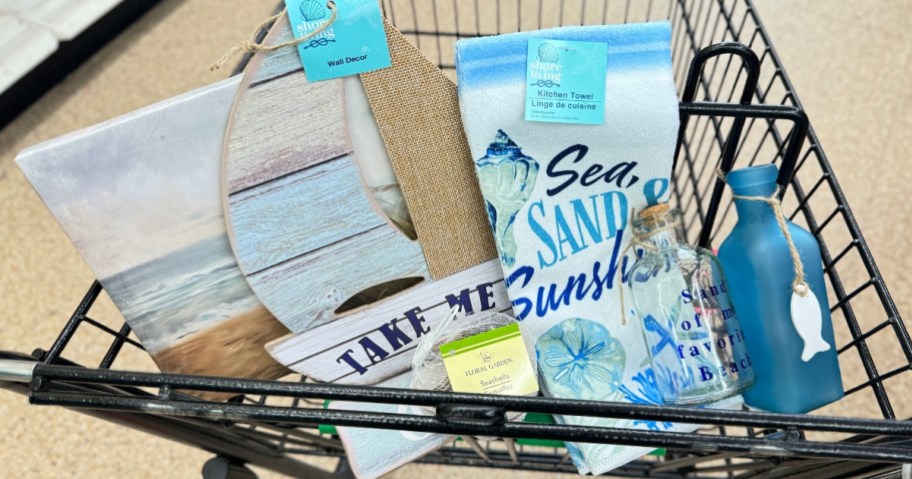 beach and coastal decor items in shopping cart at Dollar Tree