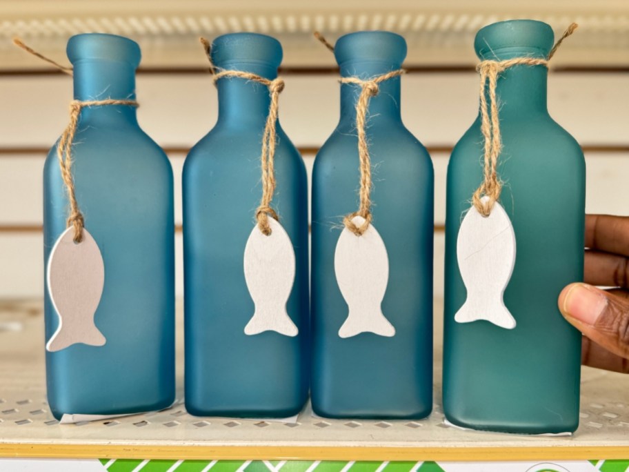 blue frosted sea glass bottles with wooden fish charms