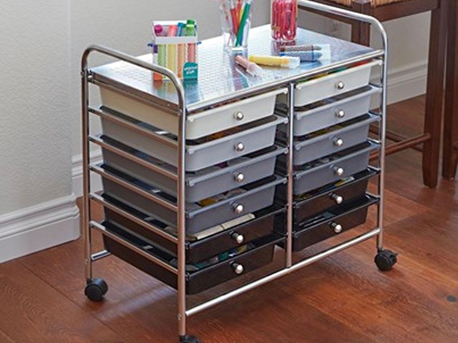 gray, white, and black 12 cart mobile shelf cart in room with pencils and art products on top