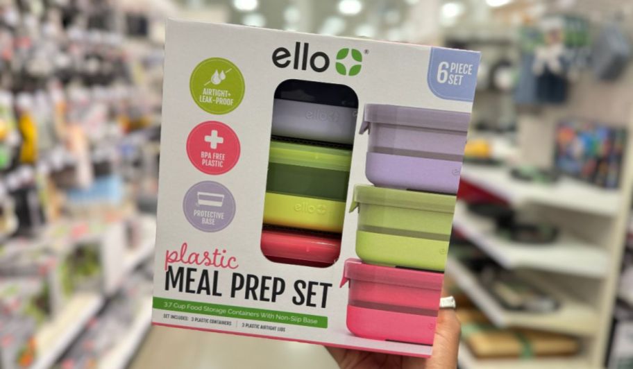 a womans hand holding Ello 6-piece food prep storage containers 