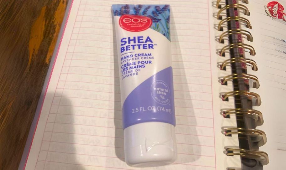 a tube of hand cream on a notebook