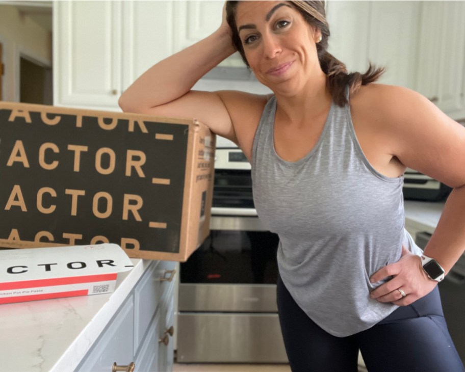 woman leaning on factor box