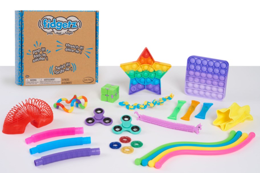 assortment of colorful fidget toys displayed in front of a box