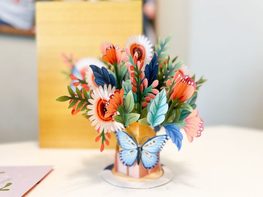 flower pop up card with butterfly standing on table 