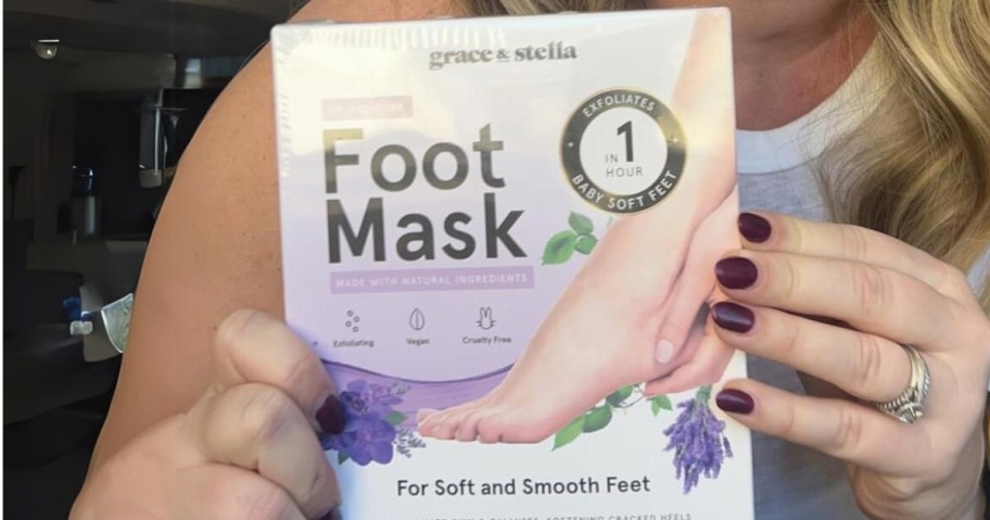 persons hands holding a box of Grace & Stella foot masks