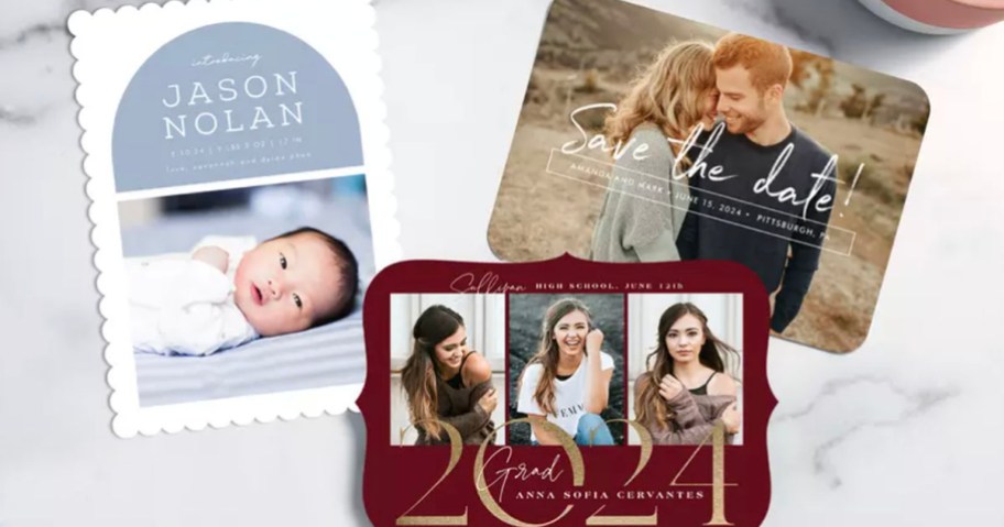 birth annoucement, graduation, and save the date photo cards laying on marble countertop