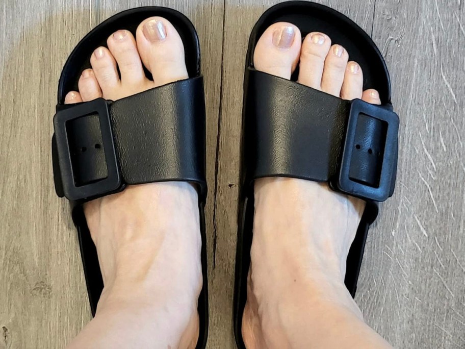 person wearing black platform sandals