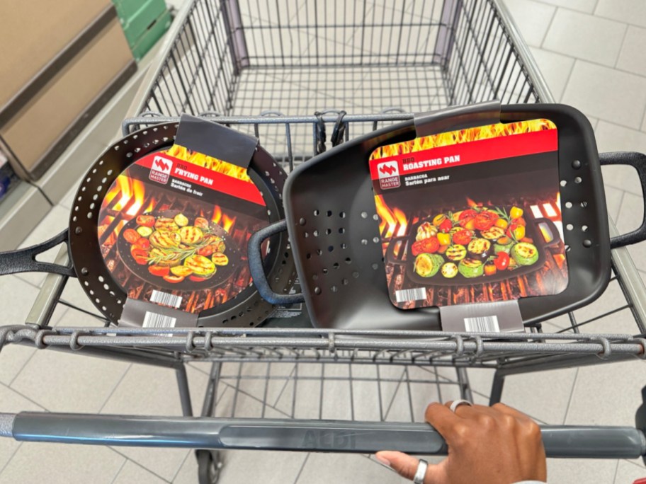hand holding ALDI BBQ and frying pan