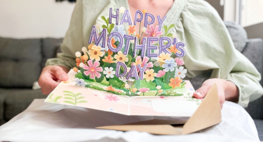 hand holding mothers day pop up 3d card