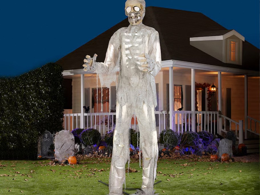 white skeleton animatronic in yard