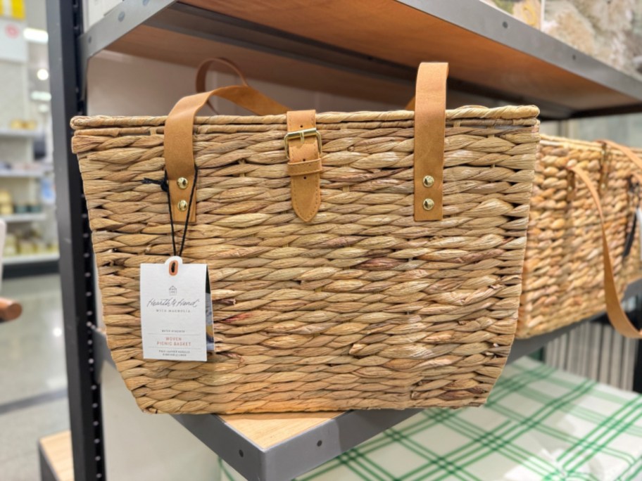 tan wicker picnic basket on shelf