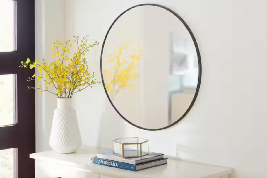 round black framed mirror