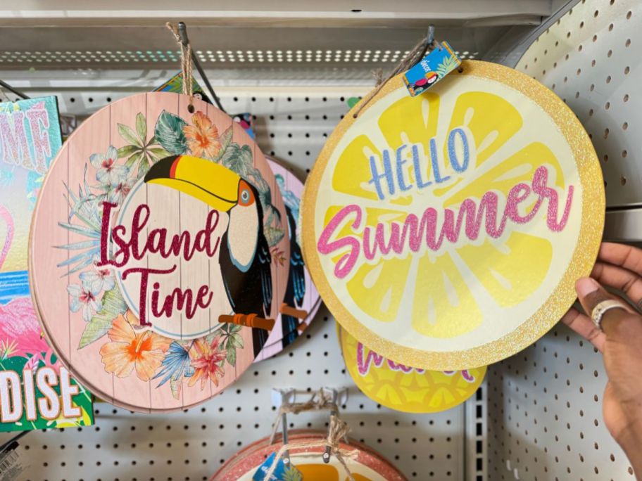 an island time and hello summer wall signs on a store aisle