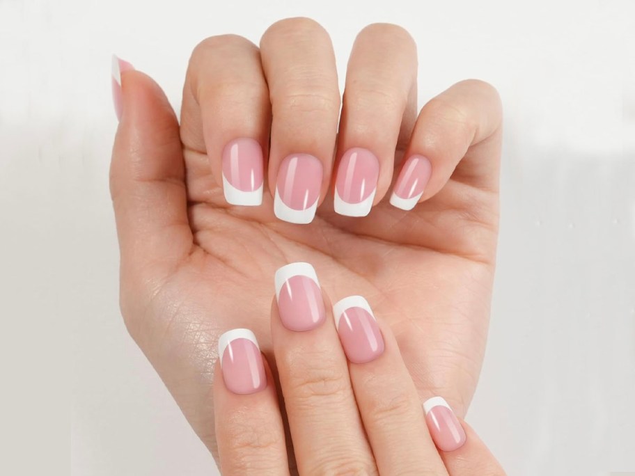 hand with french tip press on nails