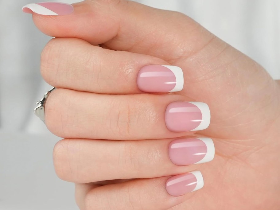 hand with french tip press on nails