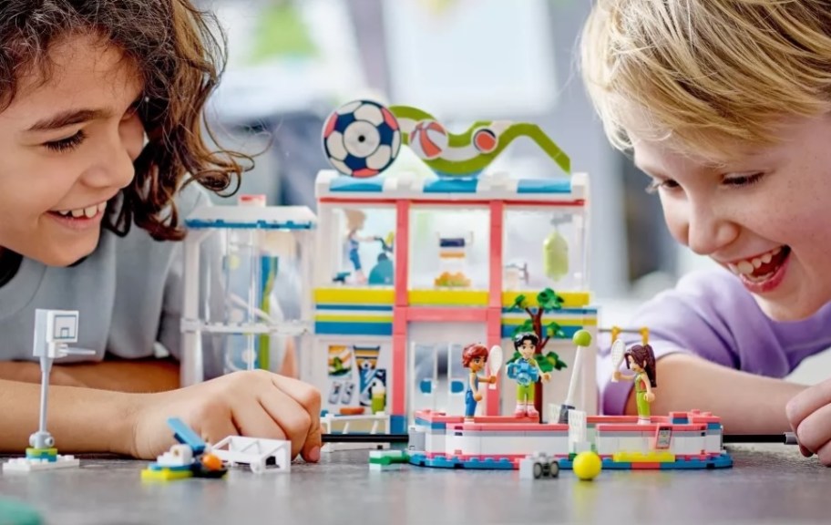 kid on left and kid on right of a LEGO Friends Sports Center building block playset