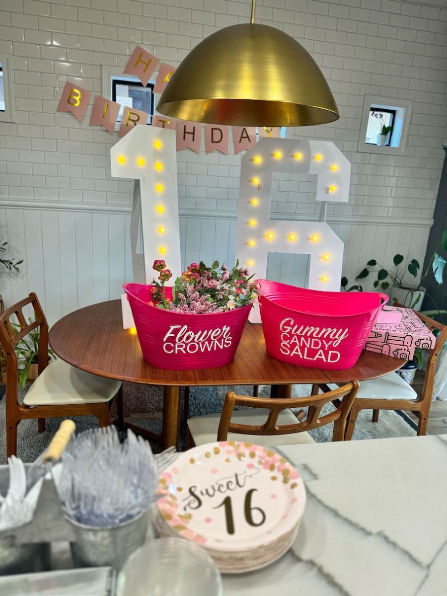 sweet 16 party decorations on table with light up marquee numbers