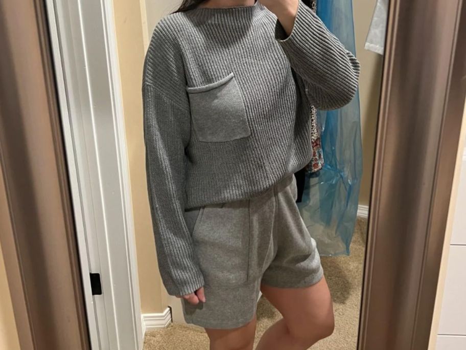 woman wearing ANRABESS Women Two Piece Outfits Sweater Sets Knit Pullover Long Sleeves Tops and Shorts Sweatsuit Lounge Set Tracksuit taking selfie in mirror