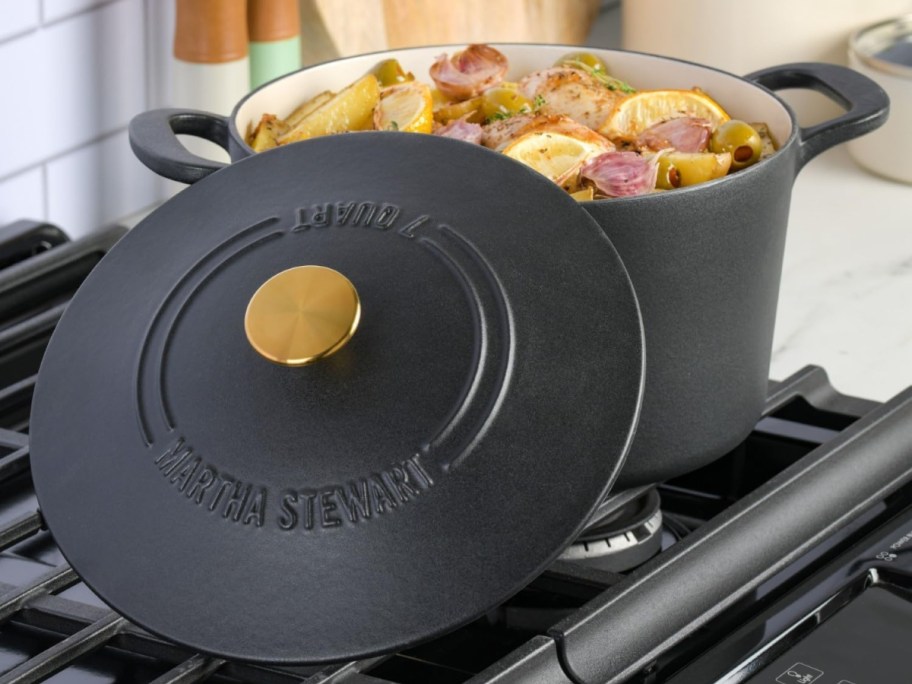 A black dutch oven with food inside.