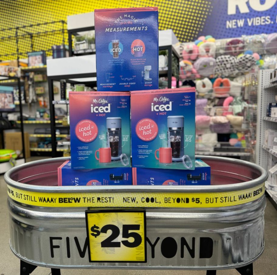 3 single serve coffeemaker boxes stacked in a steel washtub in a five below store