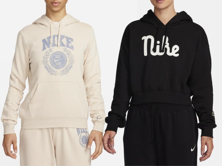 women wearing Nike hoodies, 1 in cream with blue and one in black with white Nike