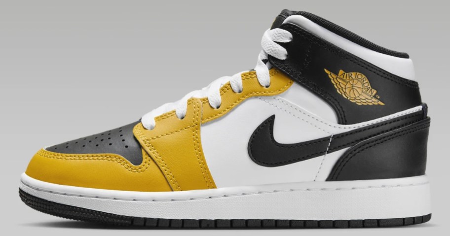 white, yellow and black kid's Nike Jordan mid shoe