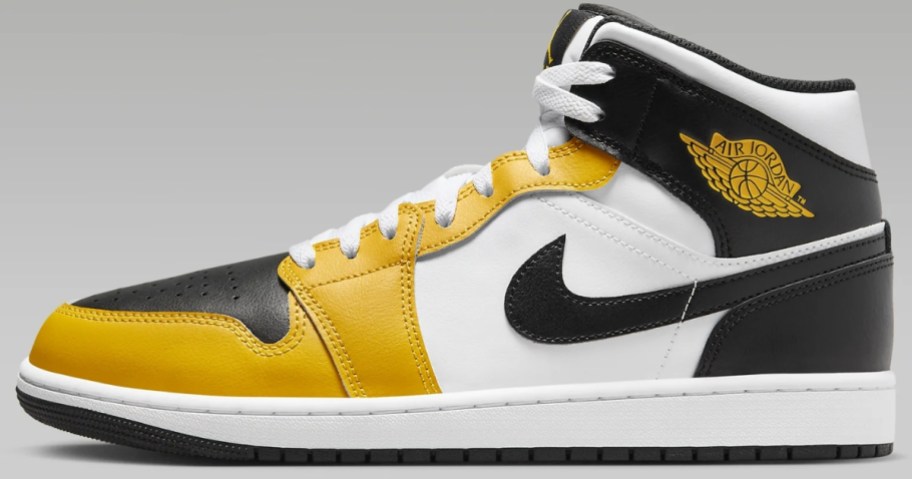 white, yellow and black men's Nike Air Jordan mid top shoe