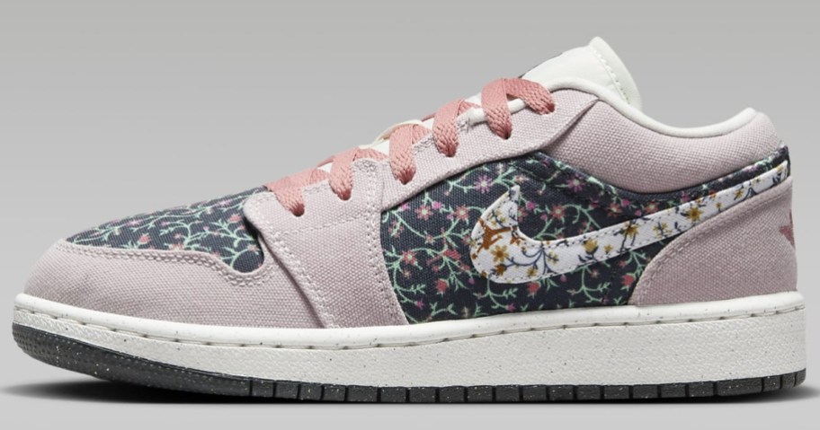 pink, white and black floral kid's Nike Jordan shoe