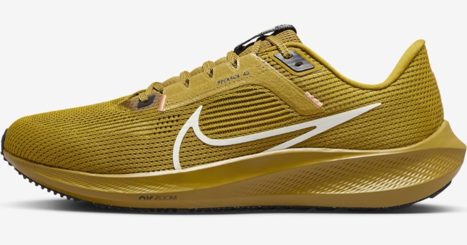 gold color Nike men's running shoe