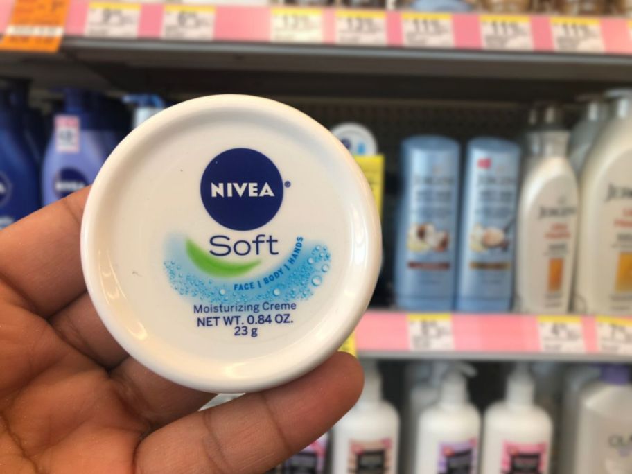 nivea soft cream being held up 