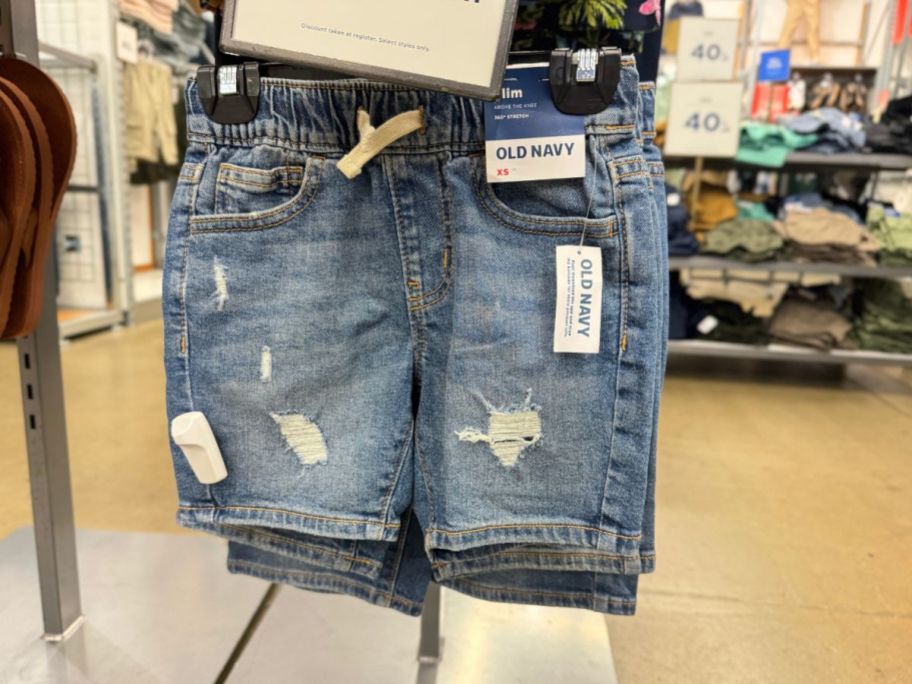 Old Navy boys denim shorts hanging in store