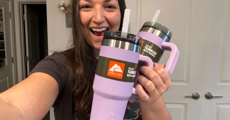 woman holding two purple ozark trail cups
