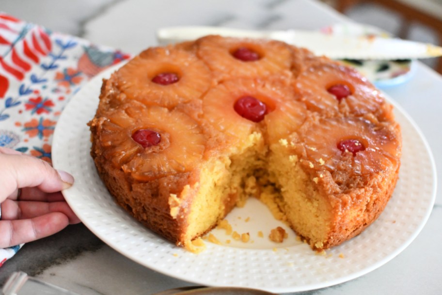 pineapple upside down cake with slice cut out