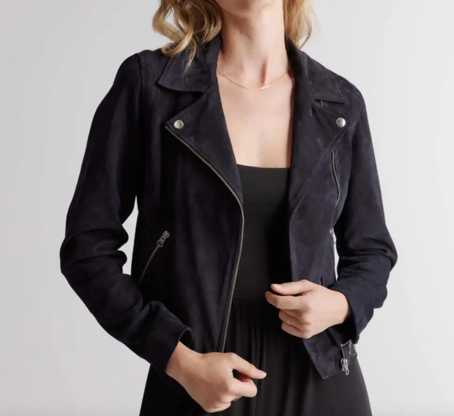 woman in black suede moto jacket