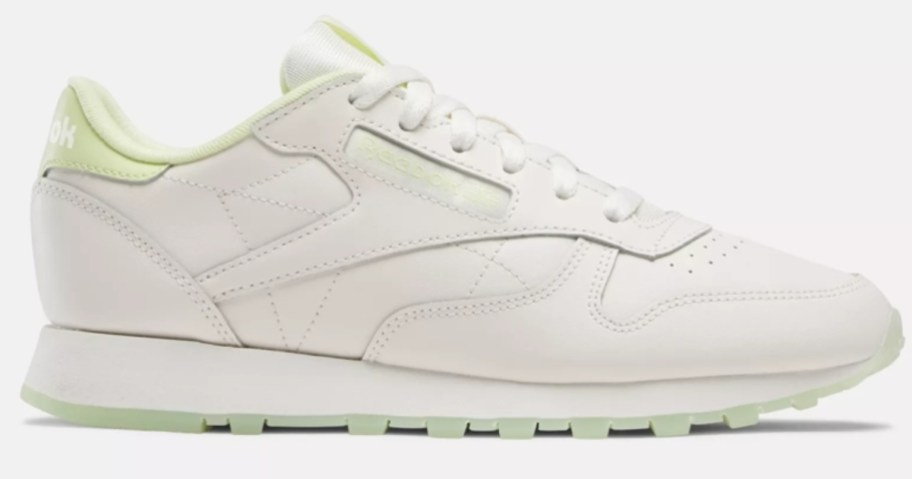 women's Reebok classic style shoe in white with bright yellow
