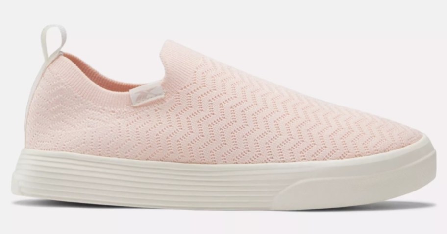 light pink and white women's slip on Reebok shoe