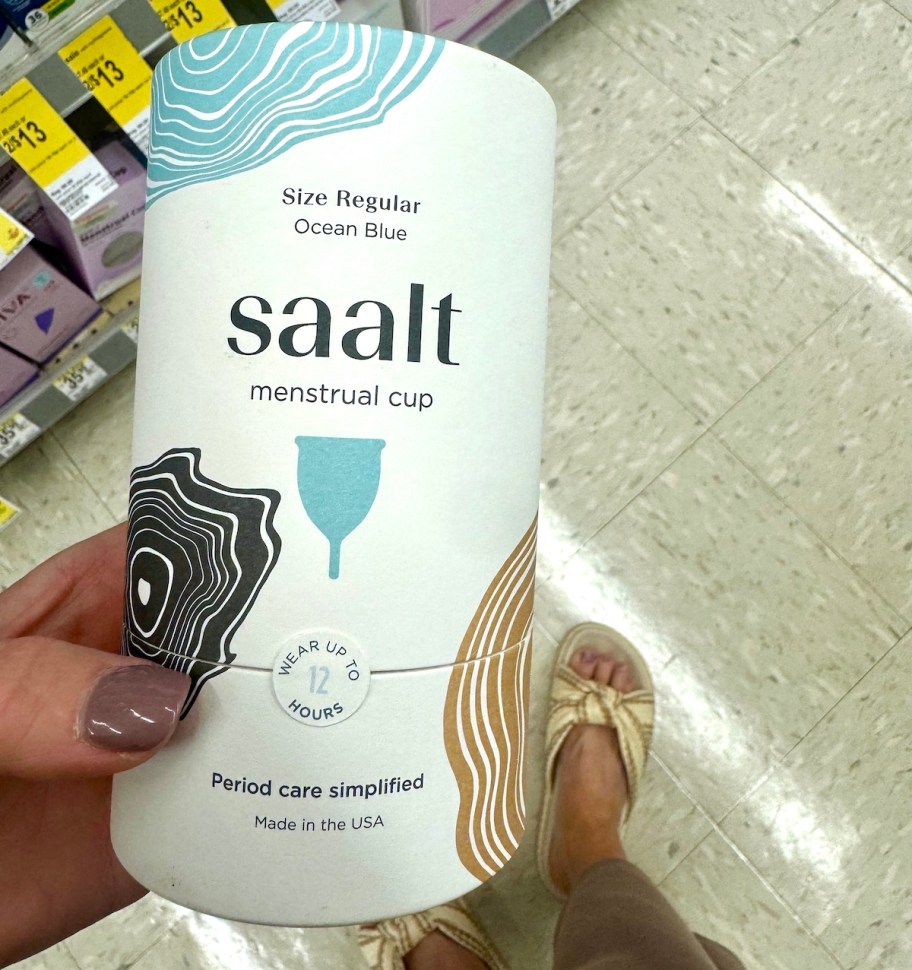 hand holding saalt menstrual cup box