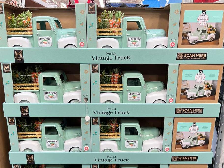 green spring vintage trucks stacked on display