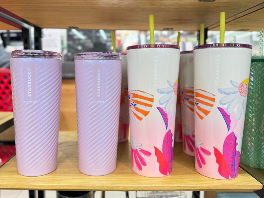 light purple Starbucks commuter mug and multi color floral cold cups on shelf
